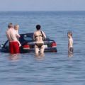 The Best Pics:  Position 55 in  - Wet Parking Lot - Car in the Sea