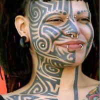 Maori-Face-Tattoo with Piercings